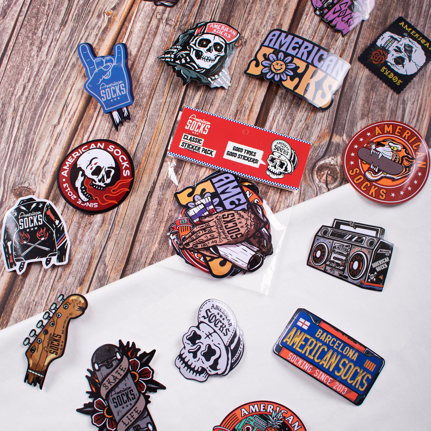 Cool alternative sticker pack surrounded by stickers with skull and rock music design american socks