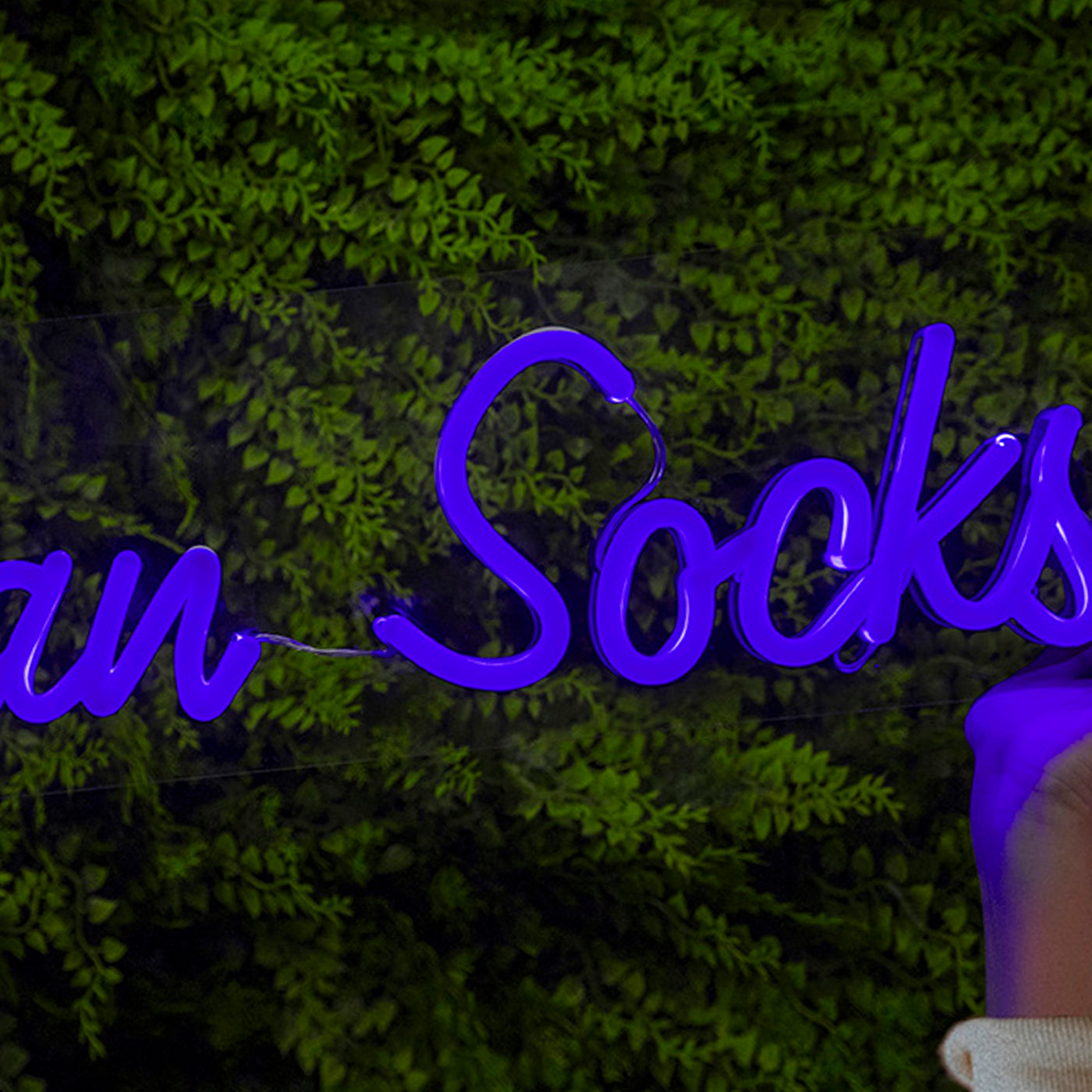Close up of american socks logo on blue neon sign 
