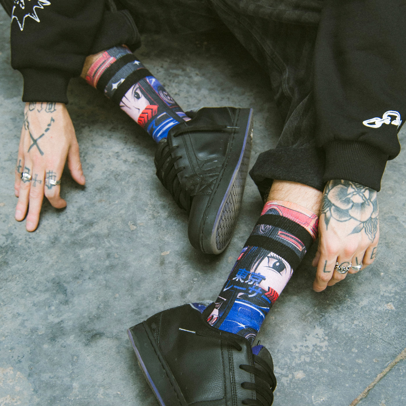 Close up of person wearing japanese anime inspired socks and alternative clothing american socks